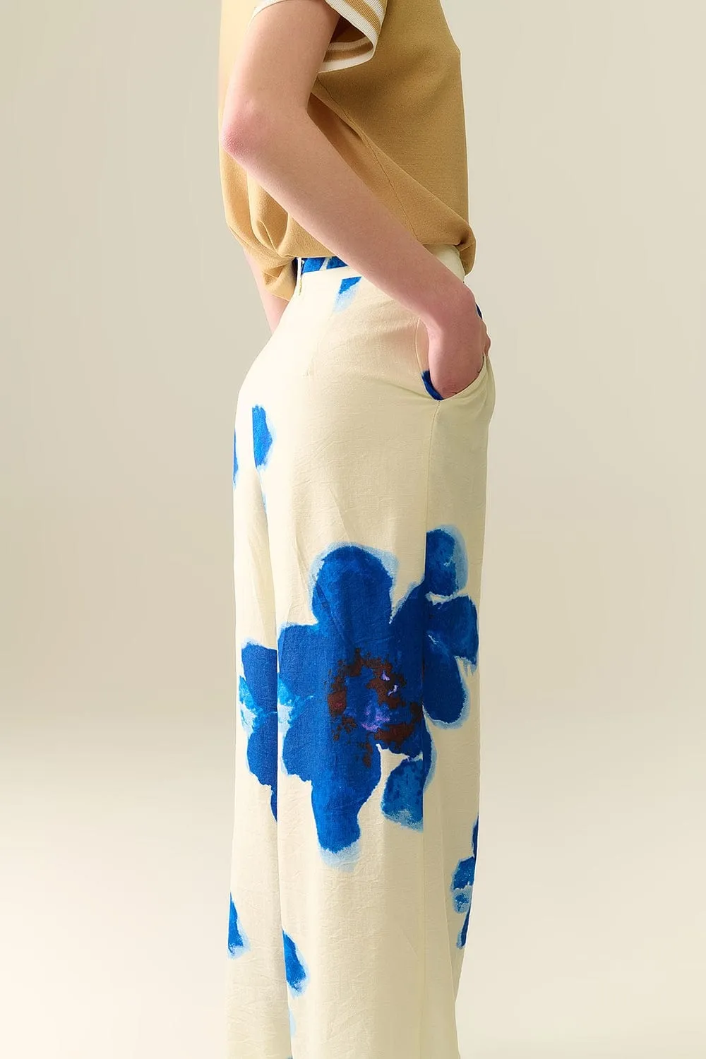 White Palazzo Pants With Blue Tropial Flower Print And Matching Belt
