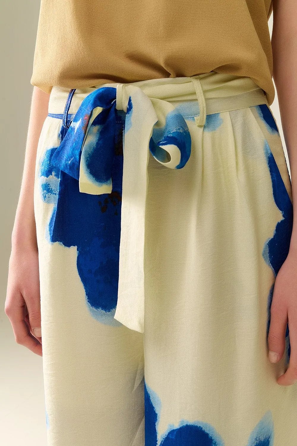 White Palazzo Pants With Blue Tropial Flower Print And Matching Belt
