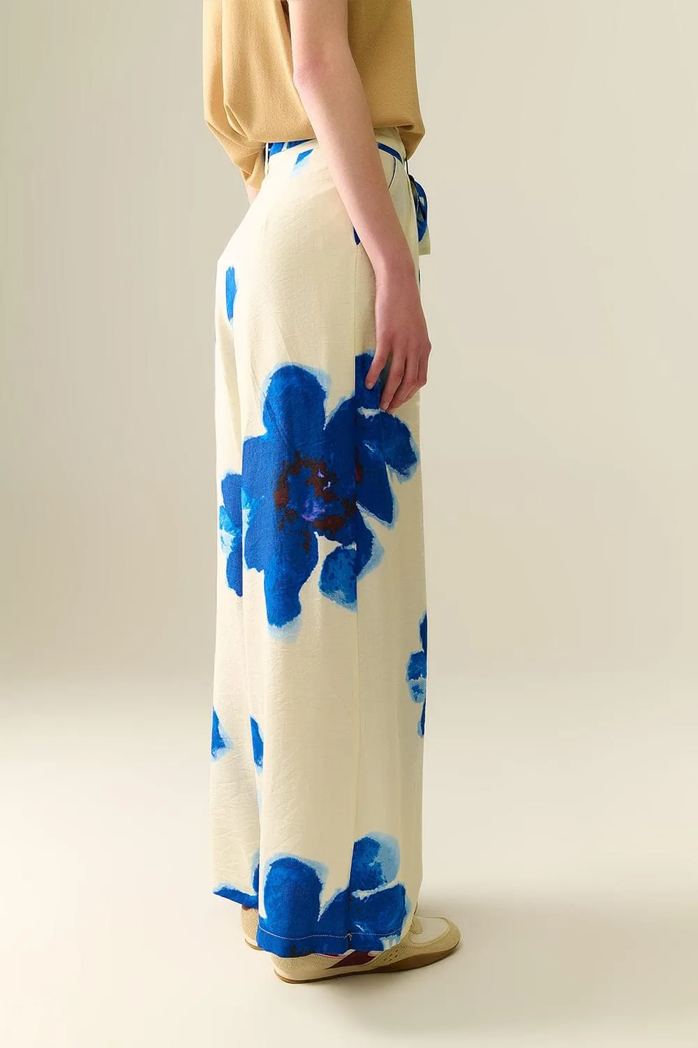 White Palazzo Pants With Blue Tropial Flower Print And Matching Belt